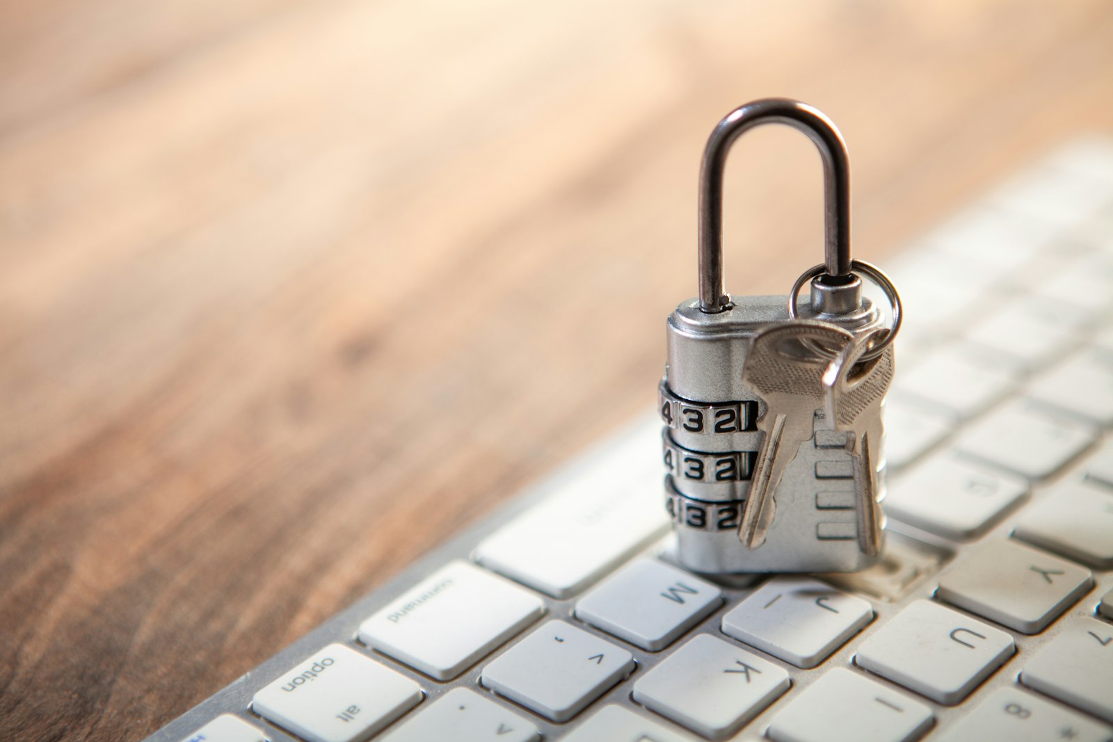Padlock on a laptop keyboard representing shared credentials